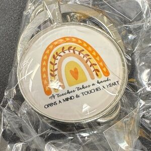 Inspirational Keychain with Rainbow Design A teacher takes a hand, opens a mind